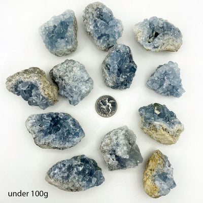 Celestite Crystals under 100 g size next to a quarter for  size reference