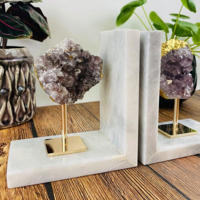 amethyst cluster on marble base bookends used as home decor
