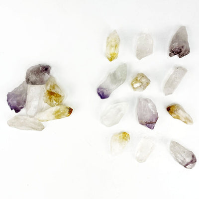 Triple Energy Set of Quartz, Amethyst and Citrine Points spread out on a table