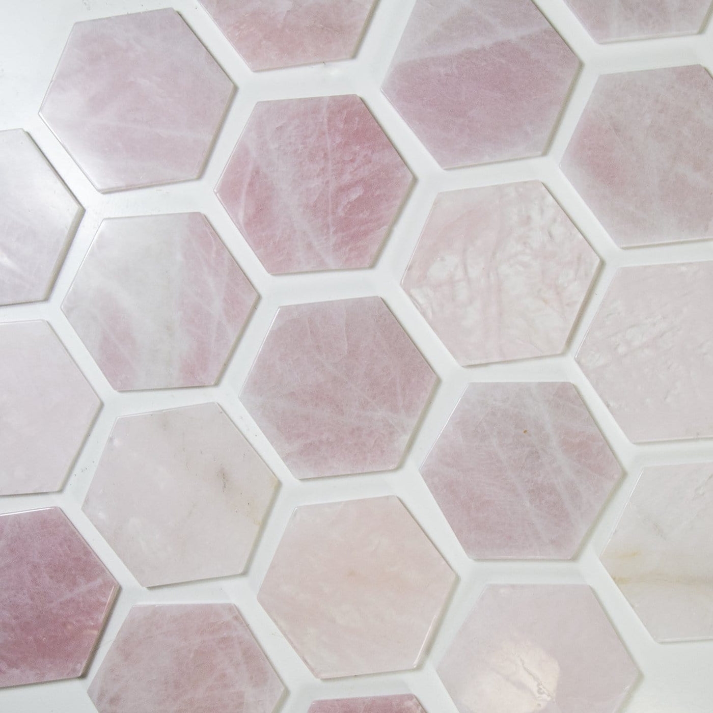 rose quartz hexagons on a table