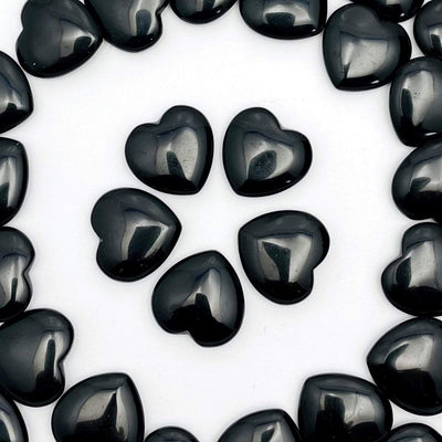 black obsidian hearts displayed on white background
