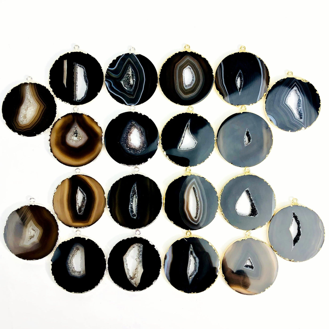 Multiple black Agate Circle Slice Pendants to show color and pattern variation.