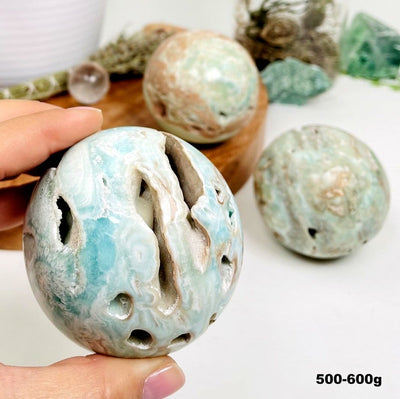 Blue Aragonite Spheres - Also known as Caribbean Calcite, showing some natural holes that may be in some of the spheres