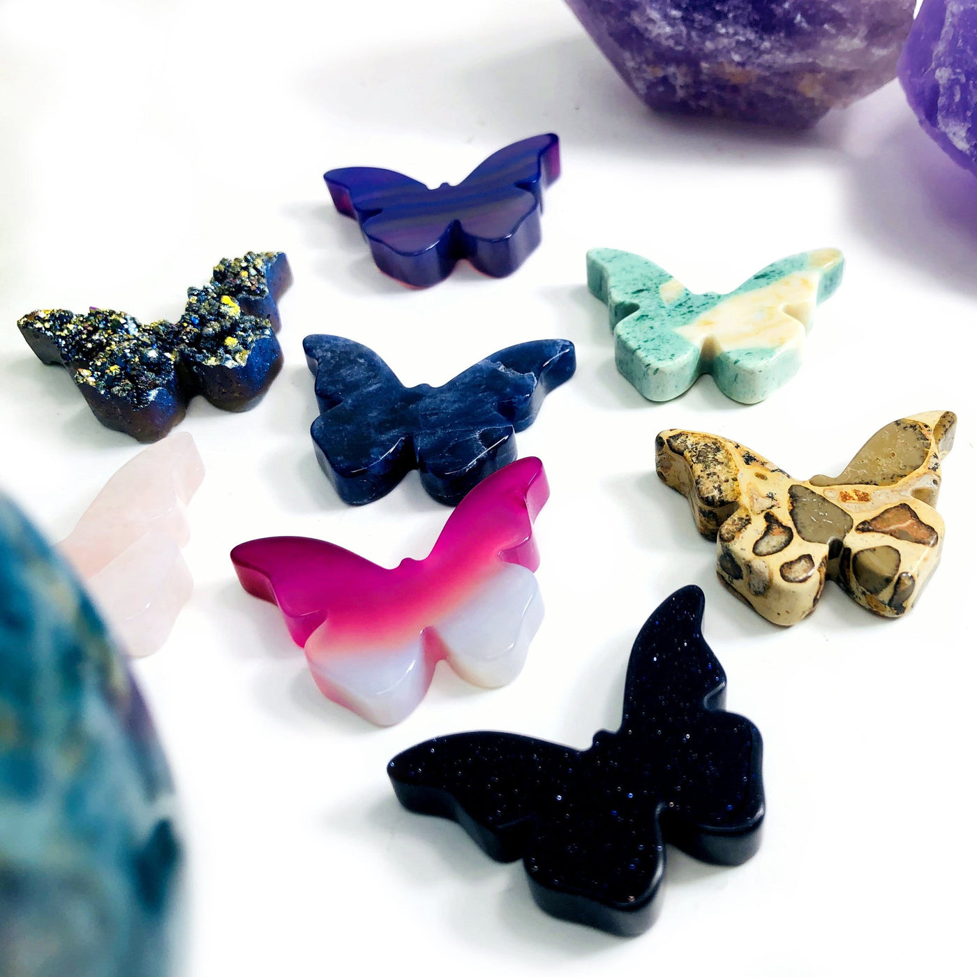 Up close view of each Butterfly Gemstone Cabochon displayed on a white surface