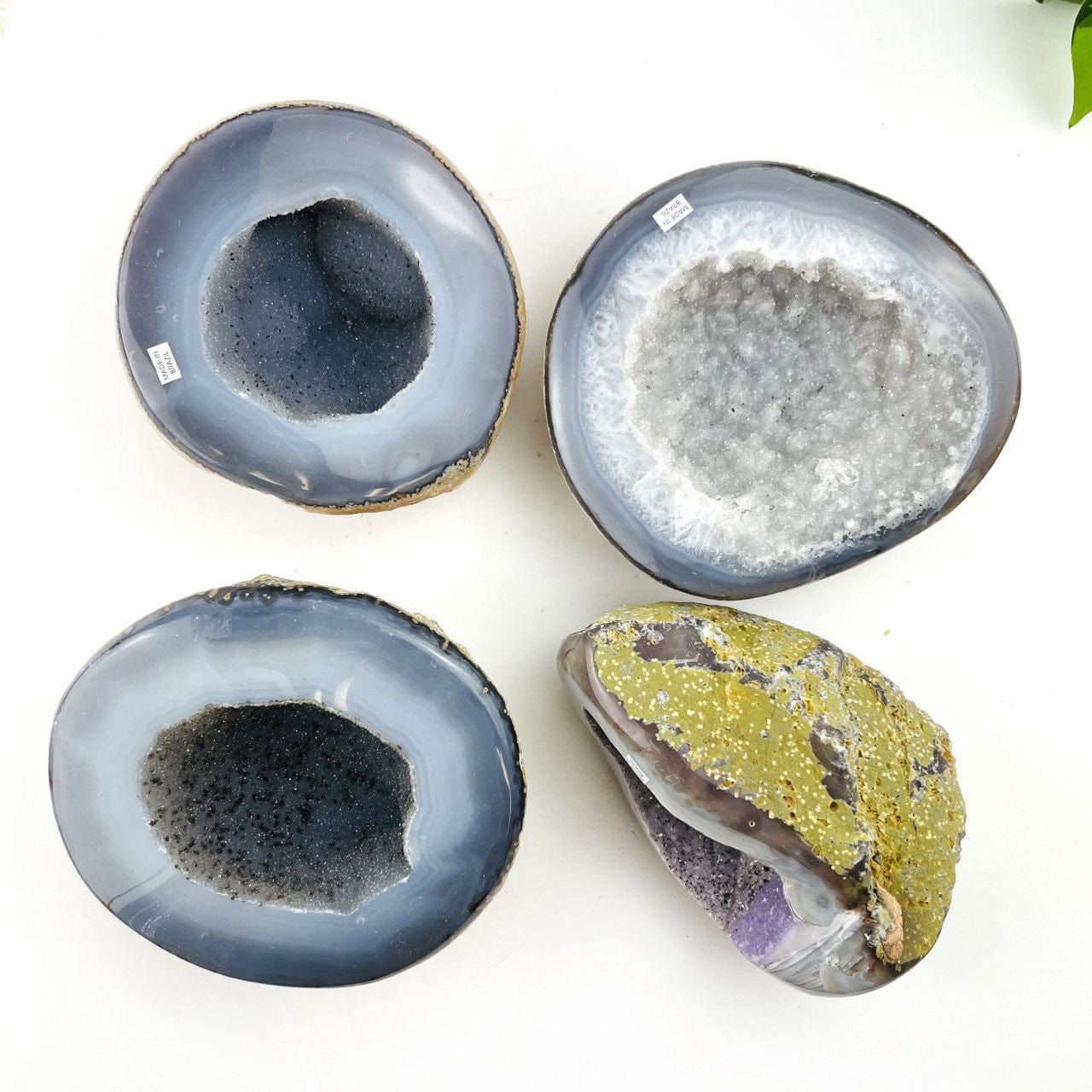 4 Agate Geodes with Druzy Centers on a table shot from overhead