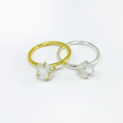 photo of a sterling silver moonstone ring and a gold over sterling moonstone ring on a white background