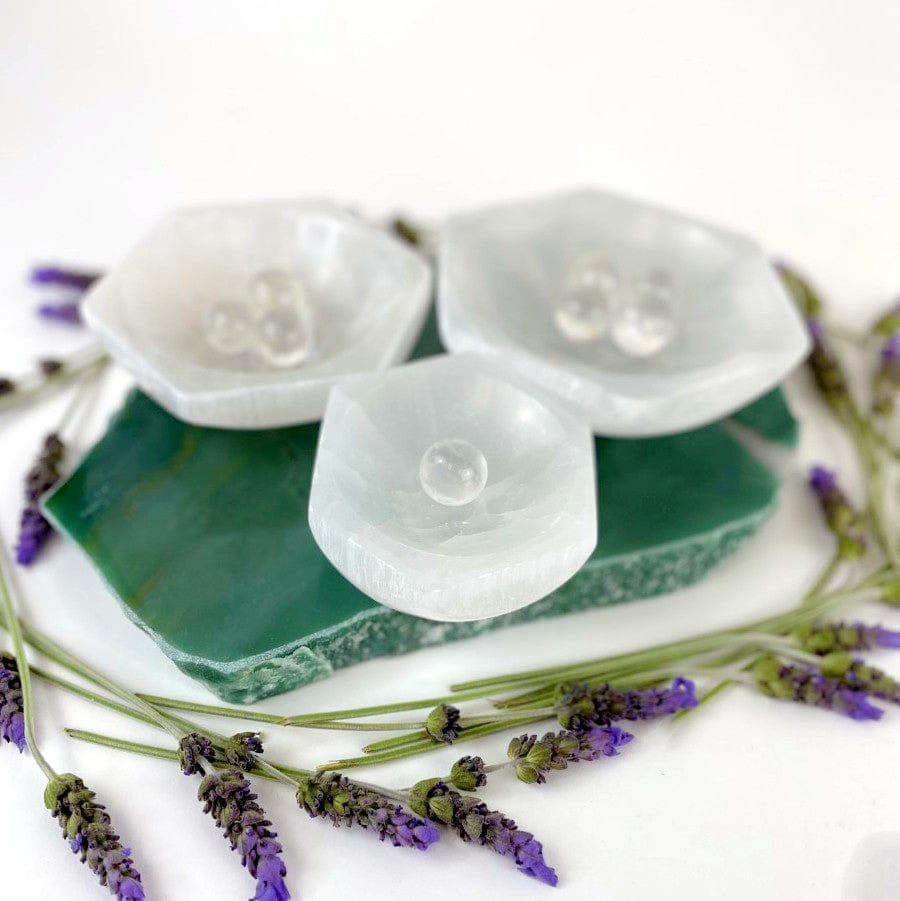 angled view of hexagon selenite charging bowls