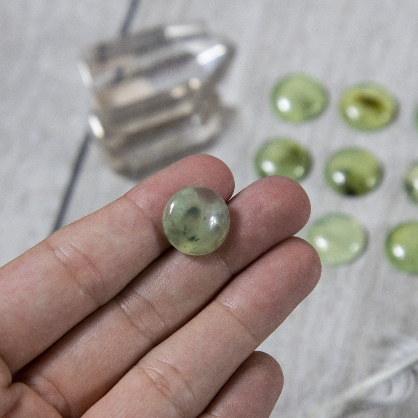 Prehnite Cabochon Stone  - one in a hand