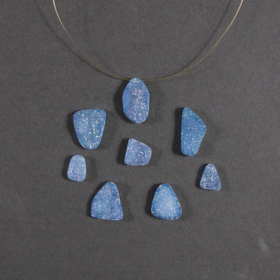 teal druzy beads displayed with a wire through hole and up close to view various colors textures shapes sizes