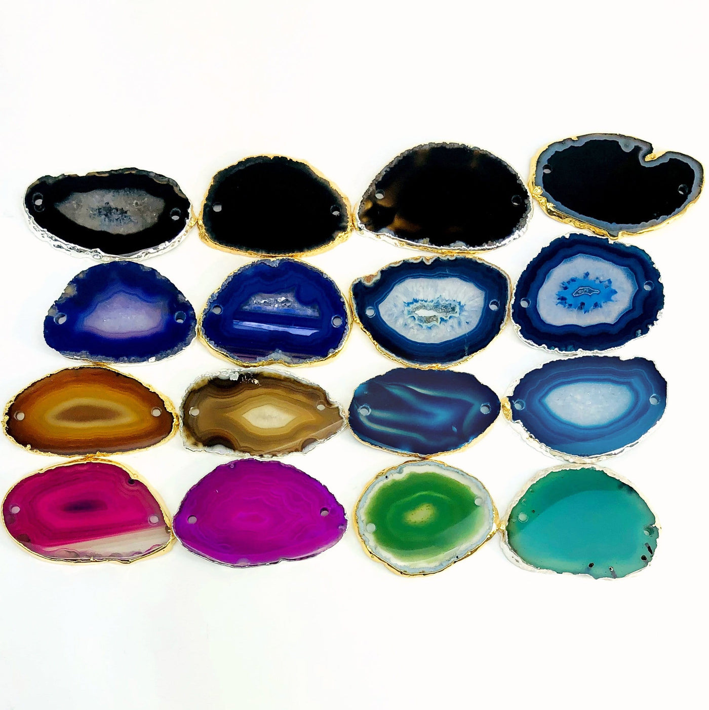 This picture is showing all the variety of colors we have available for our agate slices plated edge double drilled, on a white background.