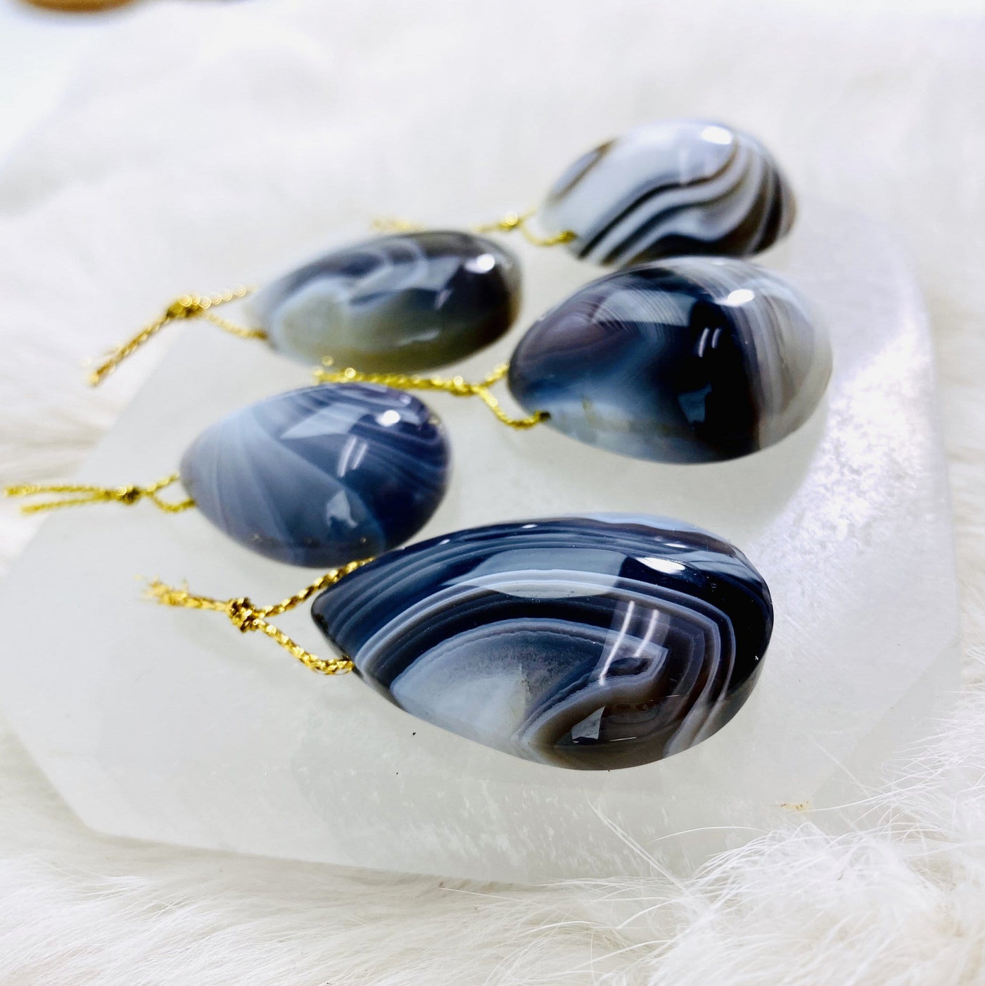 Side Picture shot of the agate tumbled pendants.