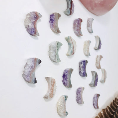 amethyst moon crescents with decorations in the background
