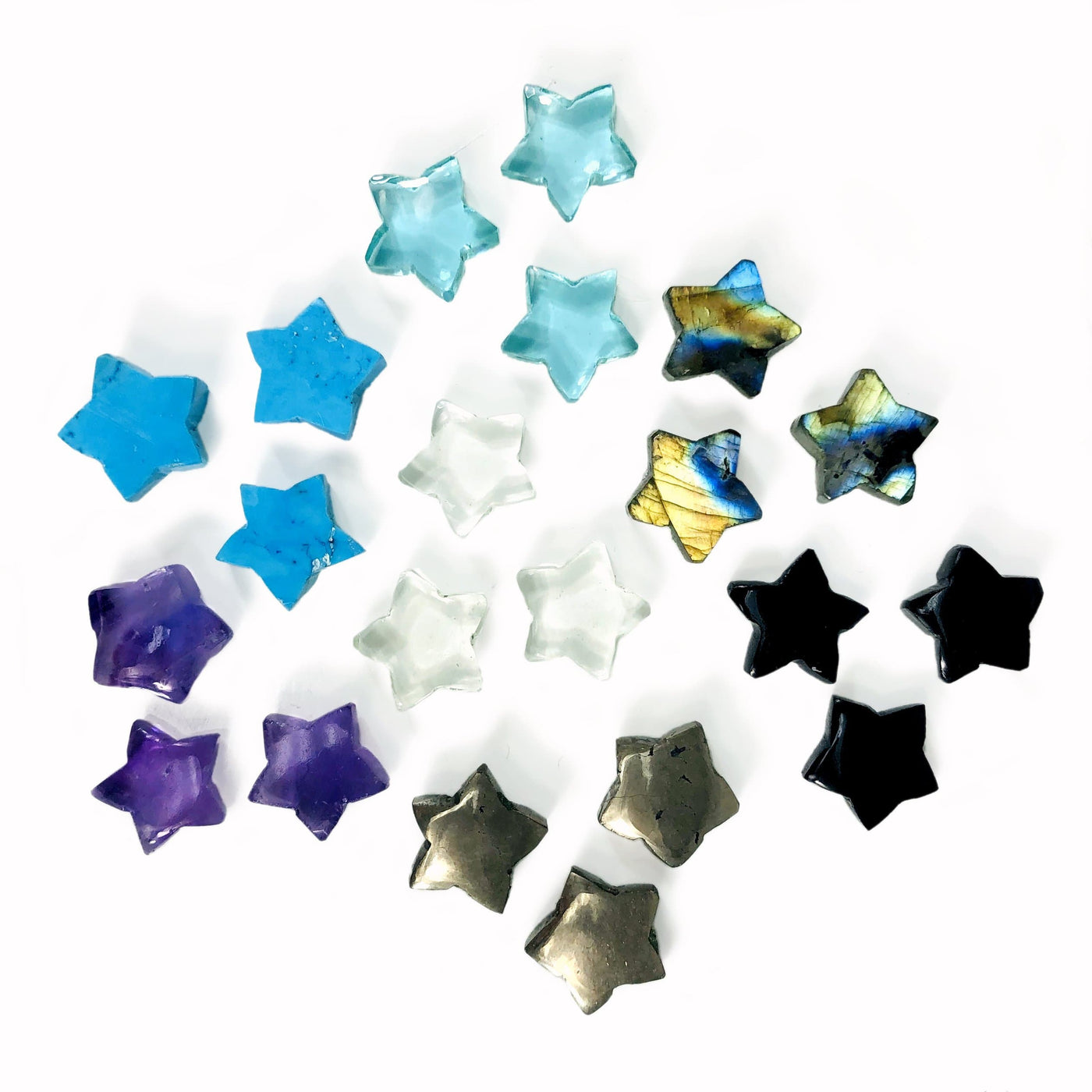 Gemstone Star Cabochons in different stones on a white background