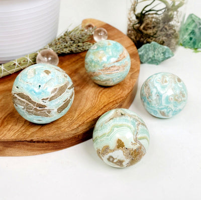 Blue Aragonite Spheres - Also known as Caribbean Calcite, showing a variety of sizes and coloring!