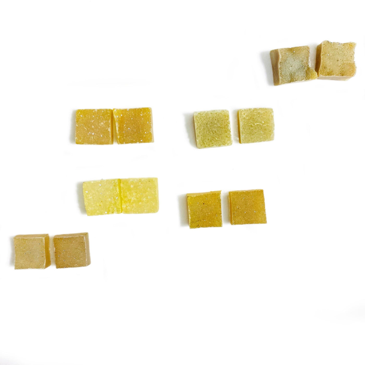 6 pairs of yellow square quartz druzy on a white background.