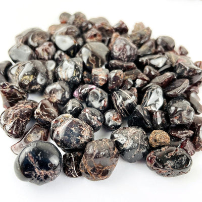 Garnet Small Tumbled Stones in a pile on a table