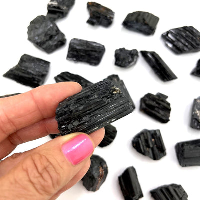 Black Tourmaline Natural Stone in a hand for size