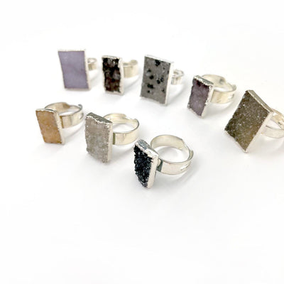 8 Quartz Druzy Rectangle Adjustable Rings from a side view