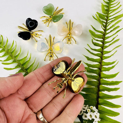 Gemstone Butterflies with Gold Tone Body  with 1 in a hand showing back side