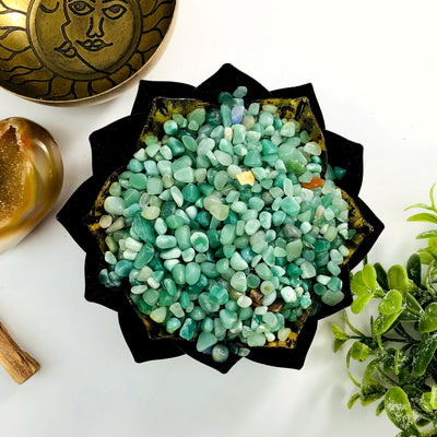 Green quartz chips in a metal lotus bowl.