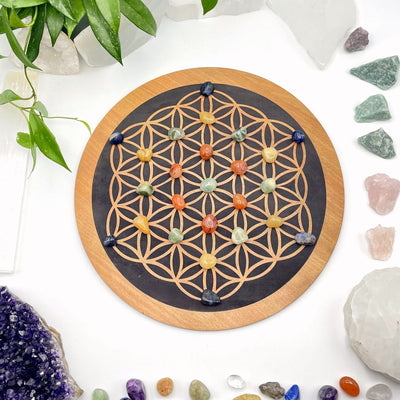 crystal grid with stones on it and crystals in the background