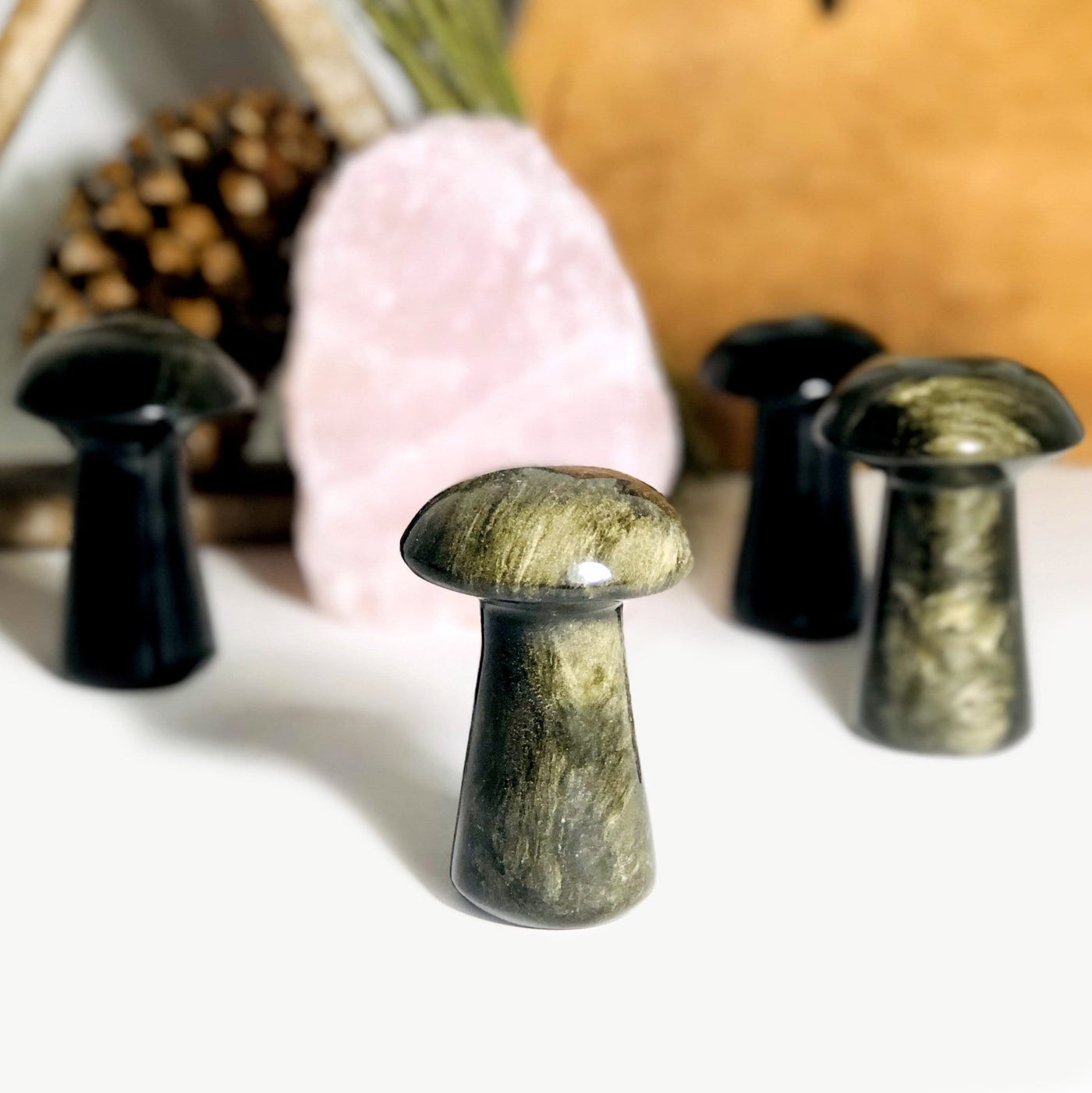 Gold Sheen Obsidian Polished Mushrooms displayed to show sheen 