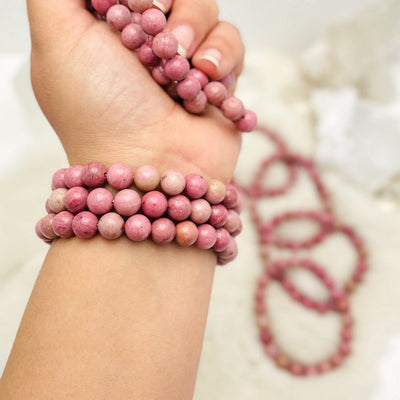 rhodonite bracelets on a arm and in the hand
