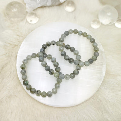 labradorite bracelets with decorations in the background