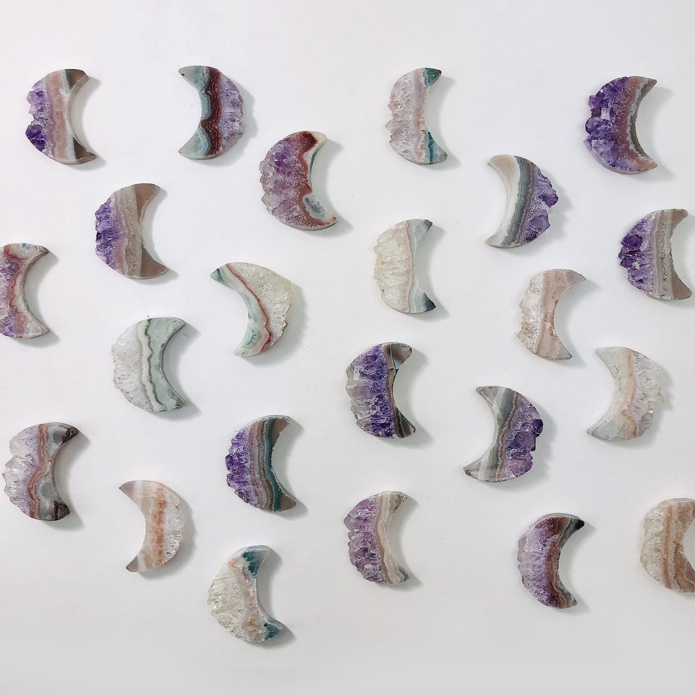 amethyst moon crescents on white background