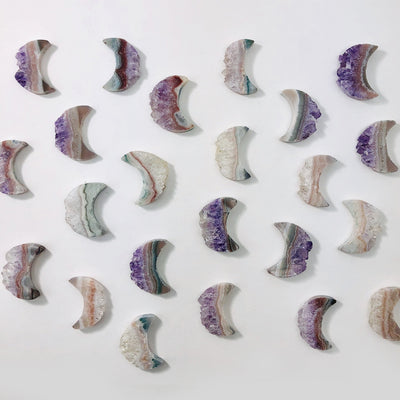 amethyst moon crescents on white background
