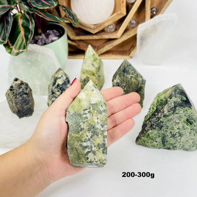 200-300g sized Jadeite Semi-polished Point displayed in hand.