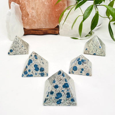 5 k2 pyramids on white background white with black and blue speckled design