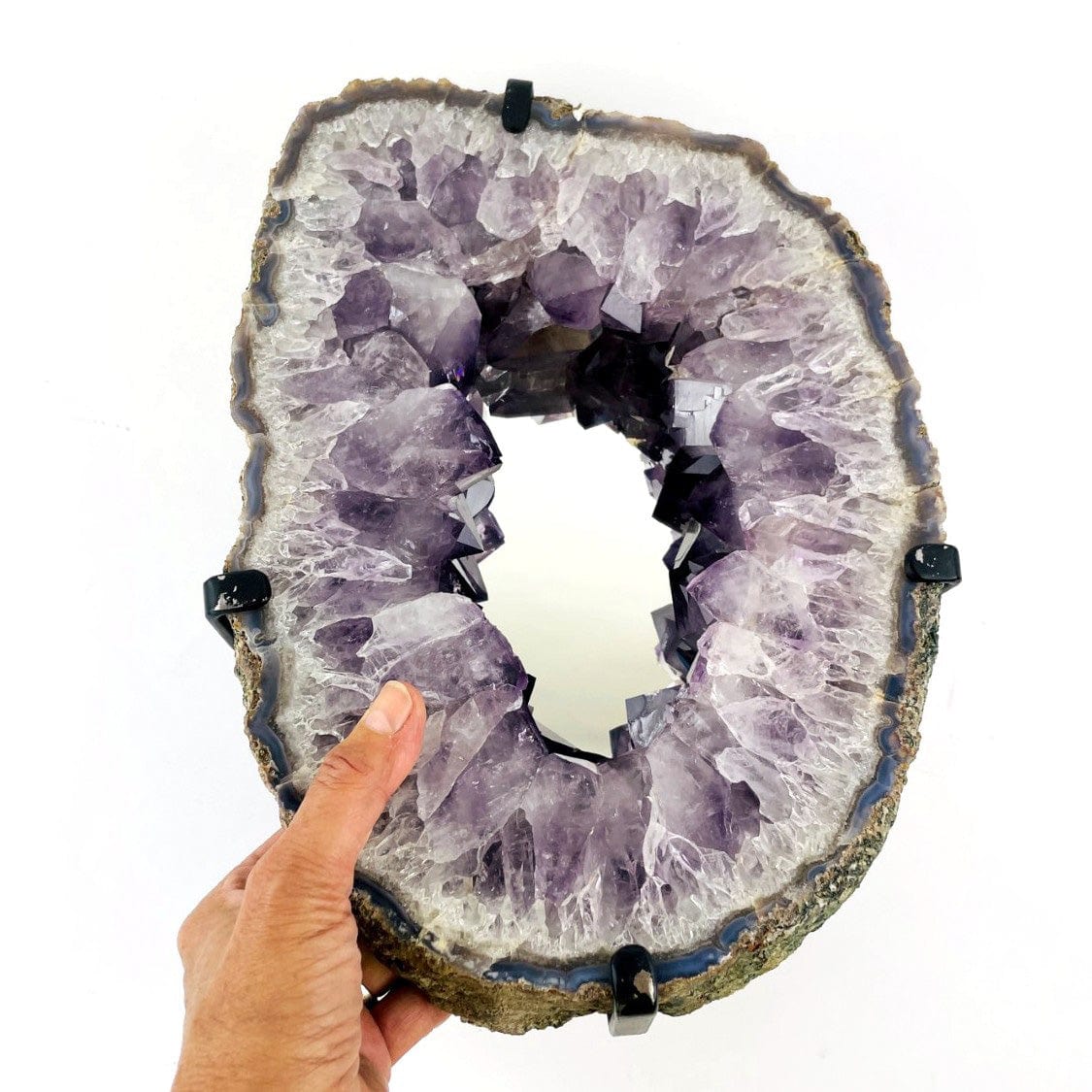 Amethyst Crystal Point Mirror with a hand for size reference