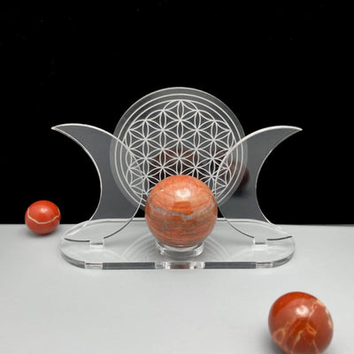 Acrylic Sphere Holder - Crescent Moons with Flower of Life displayed with a front view surrounded with a few spheres.