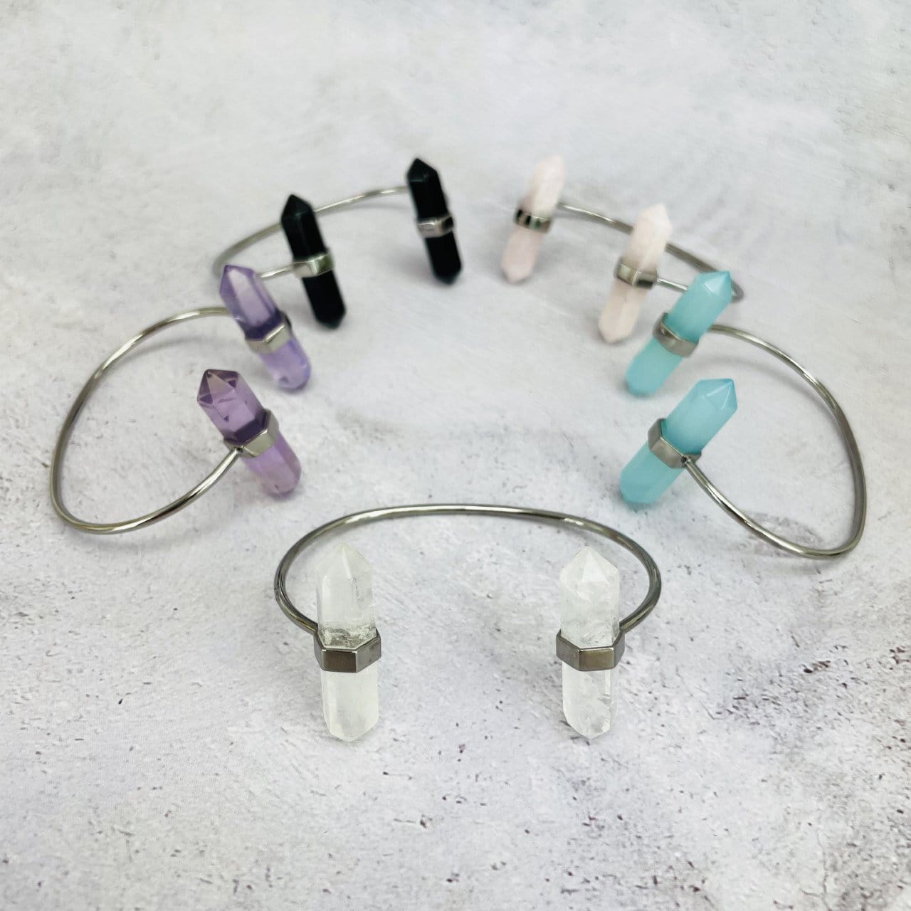 5 silver Crystal Point Cuffs in various crystals