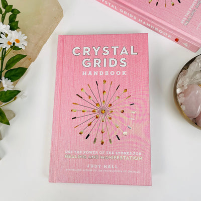 front cover of the crystal grids handbook by Judy Hall 