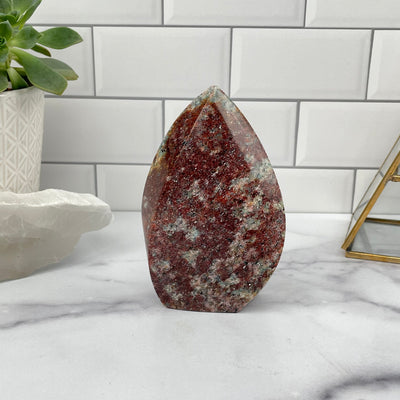 Amazonite Flame Polished Point displayed as home decor 