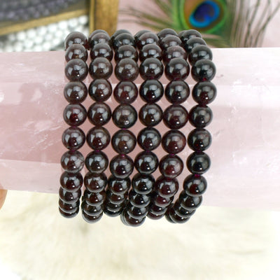 garnet bracelets with decorations in the background