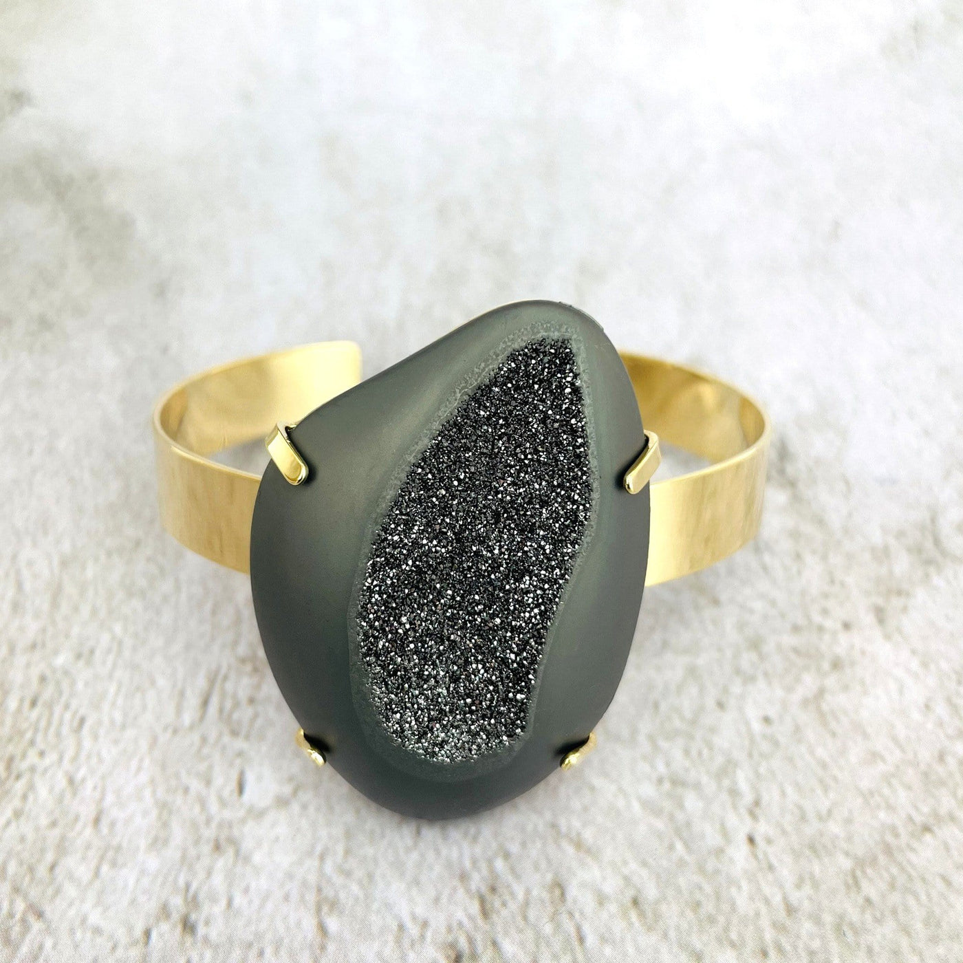 druzy cuff bracelet on gray background