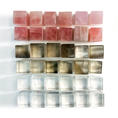 6 Sided Gemstone Cubes displayed in rose quartz smoky quartz and crystal quartz showing various color hues and natural inclusions in each stone 