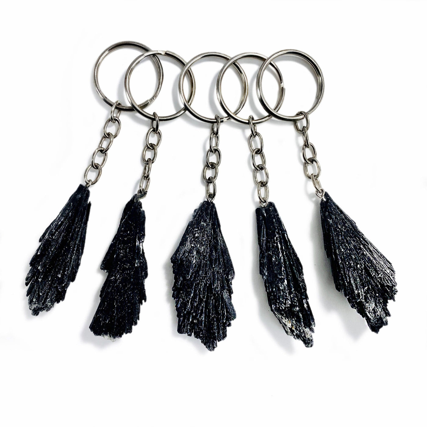 five black kyanite keychains on a white background.