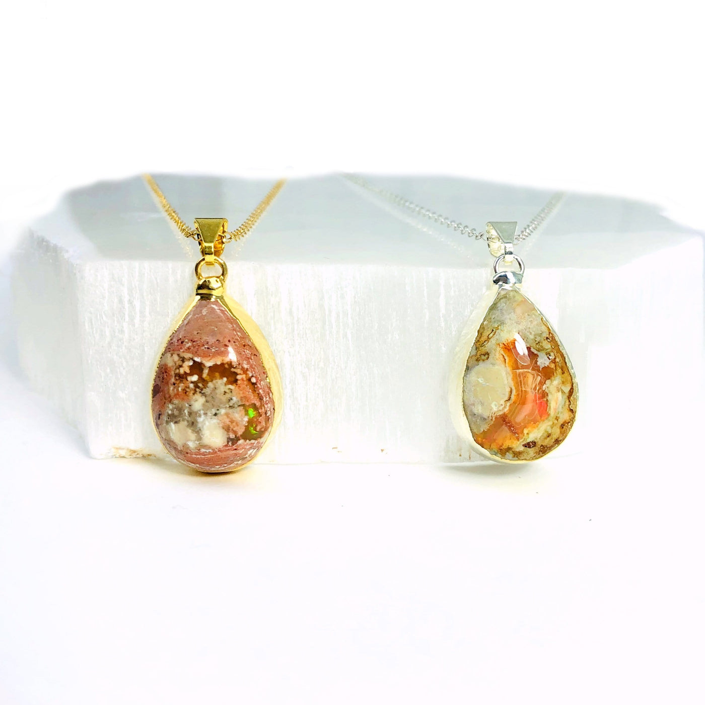 Mexican opal pendants on white background