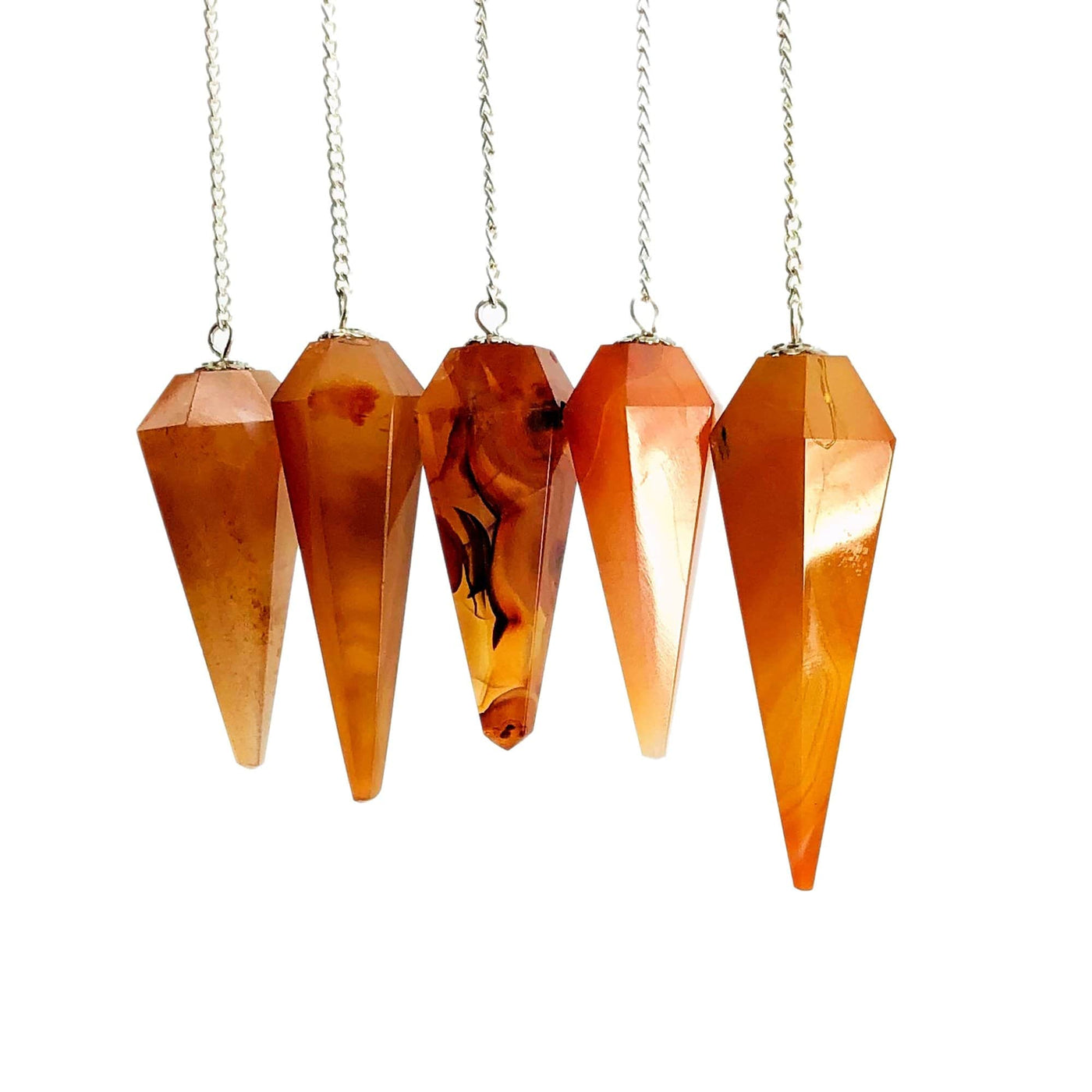 5 carnelian pendulums on silver chains with a white background