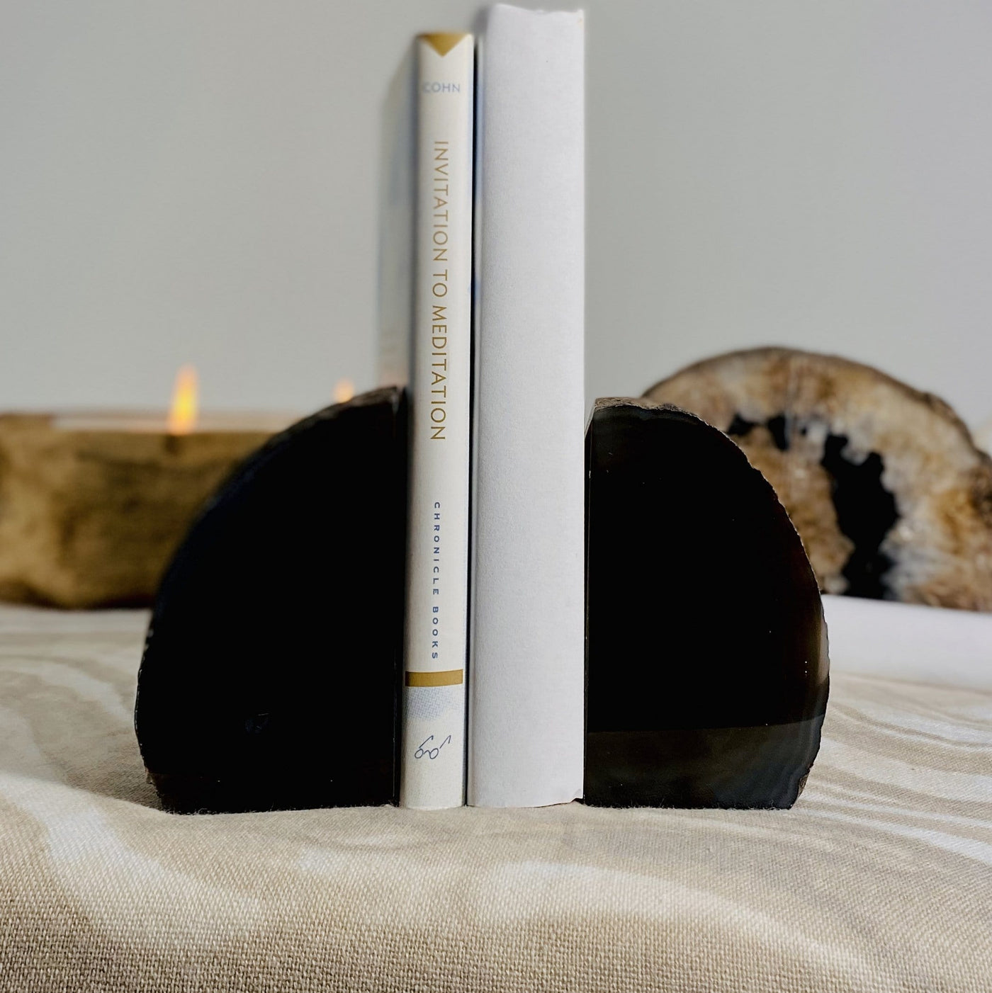 2 books in between a pair of a Black Agate Bookend