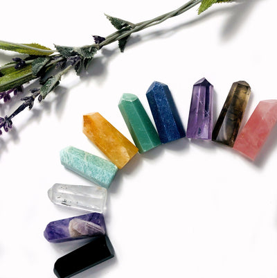 polished crystal points are displayed to show they come in black obsidian chevron amethyst crystal quartz amazonite golden healer green aventurine  blue quartz amethyst smoky quartz rose quartz