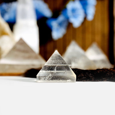 Crystal Quartz Pyramid with decorations blurred in the background