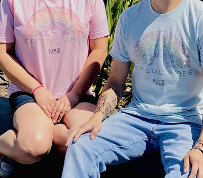 man and woman wearing pink and blue Crystal Vibes shirts