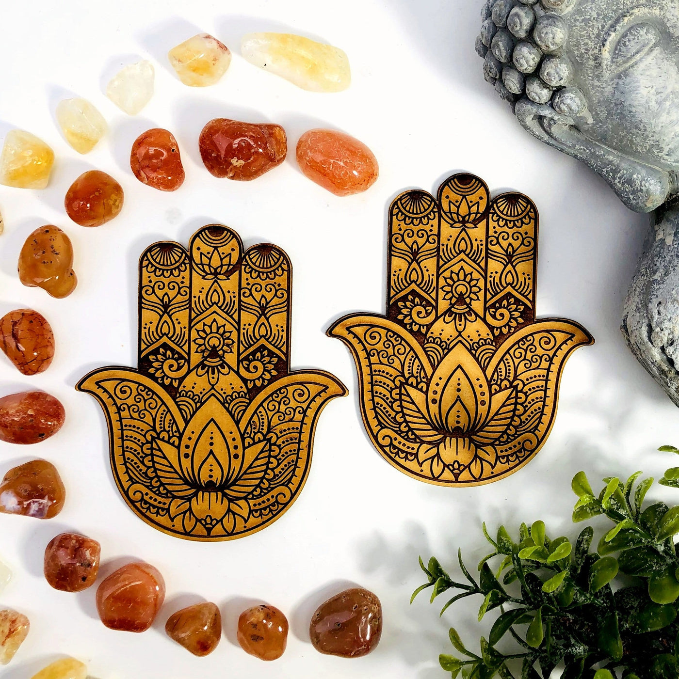 two hamsa hand wooden alter display pictured on a white background