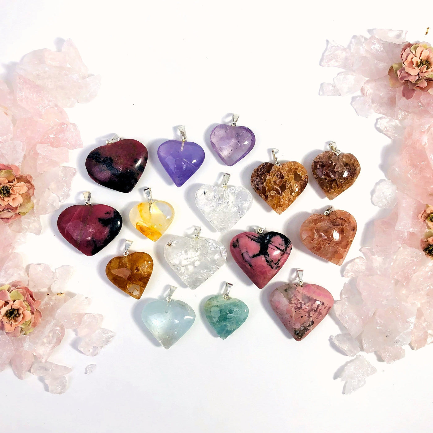 gemstone heart displayed to view variations with silver bail available in strawberry quartz