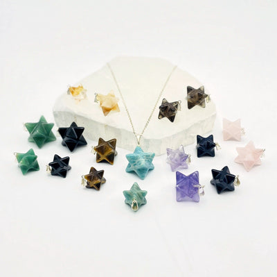 Merkabah gemstone star pendants side view to show thickness and size variations
